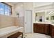 Elegant bathroom with double vanity, soaking tub, and separate shower at 6319 Vista Verde E Dr, Gulfport, FL 33707