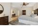 King bedroom with ensuite bath, walk-in closet and ceiling fan at 6319 Vista Verde E Dr, Gulfport, FL 33707