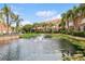 Community with pond featuring water fountains and landscaping at 6319 Vista Verde E Dr, Gulfport, FL 33707