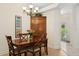 Elegant dining room with wood table and chandelier at 6319 Vista Verde E Dr, Gulfport, FL 33707