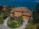 Luxury waterfront home with expansive driveway and ocean views at 806 Columbus Dr, Tierra Verde, FL 33715