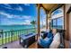 Waterfront balcony features comfortable seating with stunning ocean views and a built-in bar area at 806 Columbus Dr, Tierra Verde, FL 33715