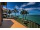 Spacious waterfront balcony with boat dock access, manicured landscaping, and breathtaking ocean views at 806 Columbus Dr, Tierra Verde, FL 33715