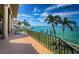 Spacious waterfront balcony overlooking the ocean and the home's private boat dock at 806 Columbus Dr, Tierra Verde, FL 33715