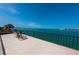 Relaxing balcony with seating and stunning water views at 806 Columbus Dr, Tierra Verde, FL 33715