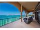 Waterfront balcony with patio furniture and stunning sunset views at 806 Columbus Dr, Tierra Verde, FL 33715