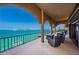 This spacious balcony features beautiful ocean views, outdoor seating, and an open-air design that combines relaxation and scenery at 806 Columbus Dr, Tierra Verde, FL 33715