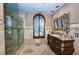 Elegant bathroom with a large glass shower and granite vanity at 806 Columbus Dr, Tierra Verde, FL 33715