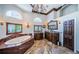 Luxurious bathroom with soaking tub, custom cabinetry, and elegant finishes at 806 Columbus Dr, Tierra Verde, FL 33715