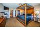 Bedroom with a four-poster bed, dresser, and TV at 806 Columbus Dr, Tierra Verde, FL 33715