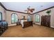 Large bedroom with ample closet space and a ceiling fan at 806 Columbus Dr, Tierra Verde, FL 33715