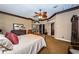 Bright bedroom with a king-size bed and access to a hallway at 806 Columbus Dr, Tierra Verde, FL 33715