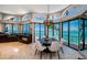 Bright dining room with water views, modern lighting, and an open floor plan at 806 Columbus Dr, Tierra Verde, FL 33715
