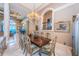 Elegant formal dining room with a large table and chandelier at 806 Columbus Dr, Tierra Verde, FL 33715