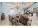 Elegant dining room with chandelier lighting and seating for eight at 806 Columbus Dr, Tierra Verde, FL 33715