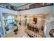 Spacious dining room with a large table and chairs, chandelier, and marble floors at 806 Columbus Dr, Tierra Verde, FL 33715