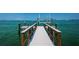 Long wooden dock extending into the ocean at 806 Columbus Dr, Tierra Verde, FL 33715