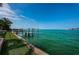 Private dock extending into the calm ocean waters at 806 Columbus Dr, Tierra Verde, FL 33715