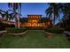 Night view of home exterior, highlighting architectural details at 806 Columbus Dr, Tierra Verde, FL 33715