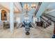 Grand foyer with marble floors, staircase, and formal dining area at 806 Columbus Dr, Tierra Verde, FL 33715