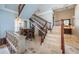 Elegant foyer features staircase, a bar area, and marble floors at 806 Columbus Dr, Tierra Verde, FL 33715