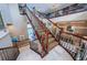 Elegant grand staircase with ornate railings and rich wood finishes at 806 Columbus Dr, Tierra Verde, FL 33715