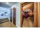 Hallway with view into the office and stairs to the upper landing at 806 Columbus Dr, Tierra Verde, FL 33715