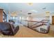 Hallway with staircase and railing, leading to the upstairs landing at 806 Columbus Dr, Tierra Verde, FL 33715
