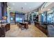 Open kitchen with island, granite counters, and stainless steel appliances at 806 Columbus Dr, Tierra Verde, FL 33715