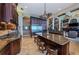 Large kitchen island with seating, granite counters and stainless steel appliances at 806 Columbus Dr, Tierra Verde, FL 33715
