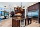 Chef's kitchen features high-end appliances, custom cabinetry, and a large island with beverage center at 806 Columbus Dr, Tierra Verde, FL 33715