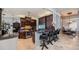 Open concept kitchen with dark wood cabinets, granite counters, and bar seating at 806 Columbus Dr, Tierra Verde, FL 33715