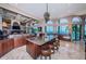 Waterfront kitchen with granite counters, stainless steel appliances, and island seating at 806 Columbus Dr, Tierra Verde, FL 33715
