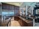 Spacious kitchen with dark wood cabinetry, stainless steel appliances, and granite countertops at 806 Columbus Dr, Tierra Verde, FL 33715