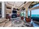 Living room with fireplace and water views at 806 Columbus Dr, Tierra Verde, FL 33715