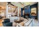 Spacious living room with high ceilings, fireplace, and a grand staircase at 806 Columbus Dr, Tierra Verde, FL 33715