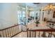 Bright living room with tile floors, fireplace, pillars, and large windows that offer an abundance of natural light at 806 Columbus Dr, Tierra Verde, FL 33715