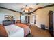 Inviting main bedroom showcasing coffered ceilings, a ceiling fan, and access to the staircase at 806 Columbus Dr, Tierra Verde, FL 33715