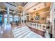 Grand foyer with marble floors, chandelier, and staircase at 806 Columbus Dr, Tierra Verde, FL 33715