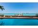 Pool area with view of the waterfront and private dock at 806 Columbus Dr, Tierra Verde, FL 33715