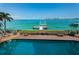 Stunning pool area with direct access to a private dock and amazing waterfront views at 806 Columbus Dr, Tierra Verde, FL 33715