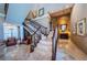 Grand staircase with ornate railings and marble flooring at 806 Columbus Dr, Tierra Verde, FL 33715