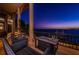 Evening view of the waterfront patio with comfortable seating and water views at 806 Columbus Dr, Tierra Verde, FL 33715