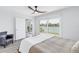 Spacious bedroom with water views and access to a private balcony at 340 Pinellas Bayway S # 206, Tierra Verde, FL 33715