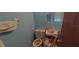 Small bathroom with toilet and sink at 8194 Wpa Rd, Brooksville, FL 34601