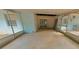 Enclosed patio with concrete floor and sliding glass doors at 8194 Wpa Rd, Brooksville, FL 34601