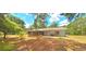 House back view, screened porch, and fenced yard at 8194 Wpa Rd, Brooksville, FL 34601