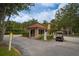 Gated community entrance with guardhouse and golf cart at 2400 Feather Sound Dr # 1317, Clearwater, FL 33762