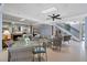 Common area with multiple tables and wicker chairs at 300 Woodette Dr # 203, Dunedin, FL 34698
