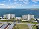 Aerial view of waterfront community with two buildings and parking at 300 Woodette Dr # 203, Dunedin, FL 34698